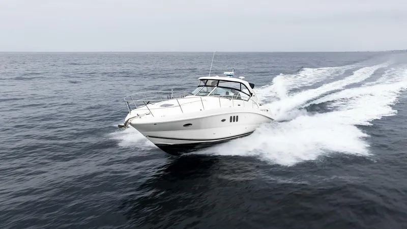  Yacht Photos Pics 2008 Sea Ray 38 Sundancer cruising on open water, creating a dynamic wake.