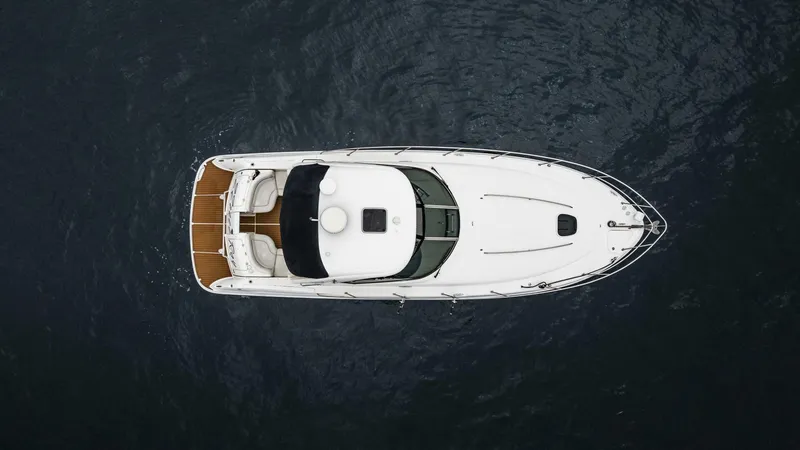  Yacht Photos Pics Aerial view of 2008 Sea Ray 38 Sundancer yacht on dark water.