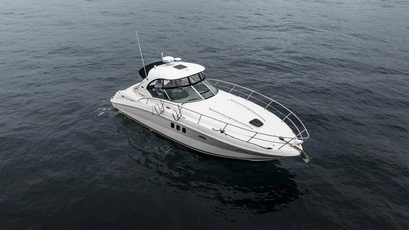  Yacht Photos Pics 2008 Sea Ray 38 Sundancer yacht cruising on open water.