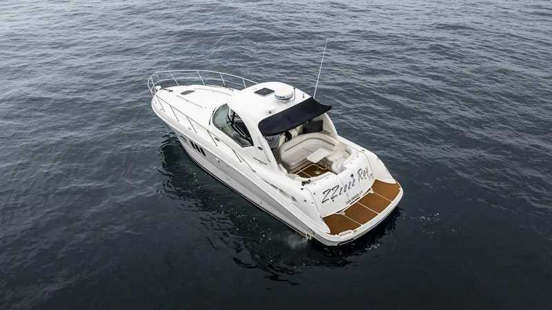  Yacht Photos Pics 2008 Sea Ray 38 Sundancer yacht on calm ocean waters, aerial view.