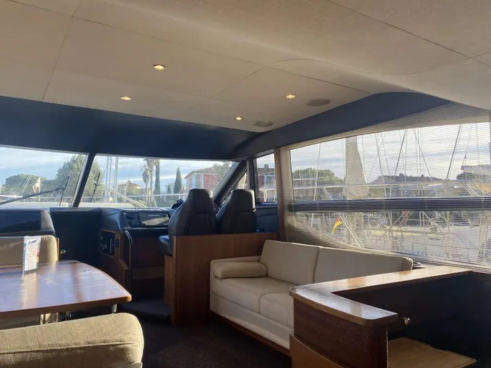  Yacht Photos Pics Interior of 2013 Princess Flybridge 52 Motor Yacht with elegant seating and panoramic windows.