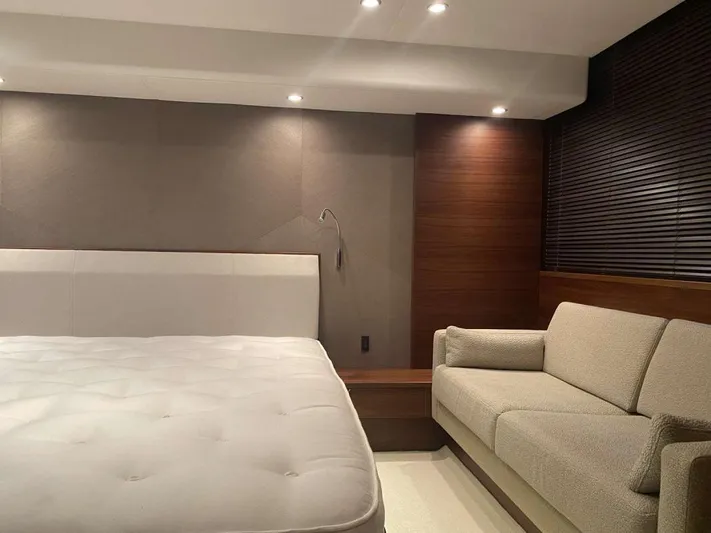  Yacht Photos Pics Luxurious interior of 2013 Princess Flybridge 52 Motor Yacht with bed and sofa.