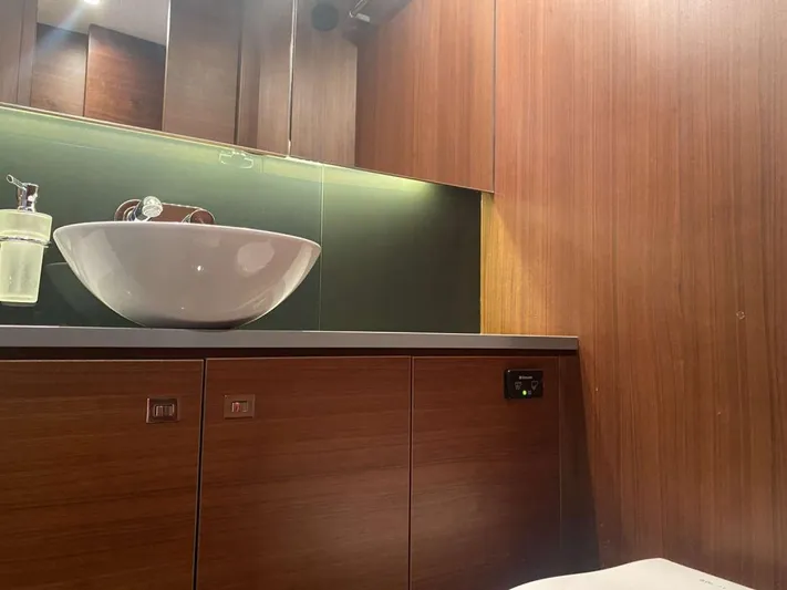  Yacht Photos Pics Luxurious wooden bathroom interior on a 2013 Princess Flybridge 52 Motor Yacht.