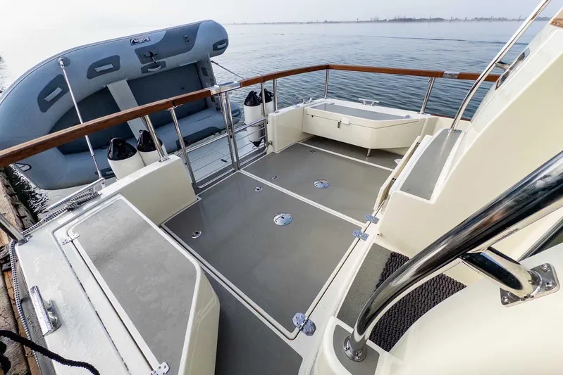  Yacht Photos Pics 2020 Targa 32 boat deck with inflatable dinghy, featuring sleek design and railing.