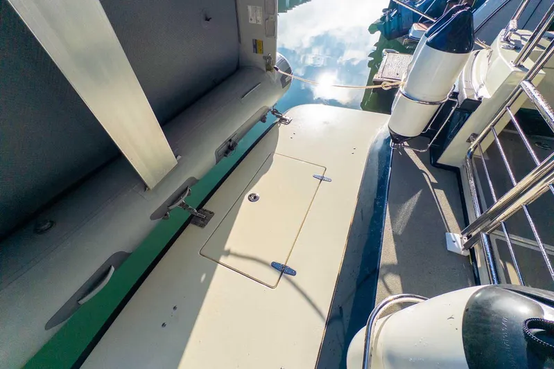  Yacht Photos Pics 2020 Targa 32 boat deck with storage hatch and safety railings.