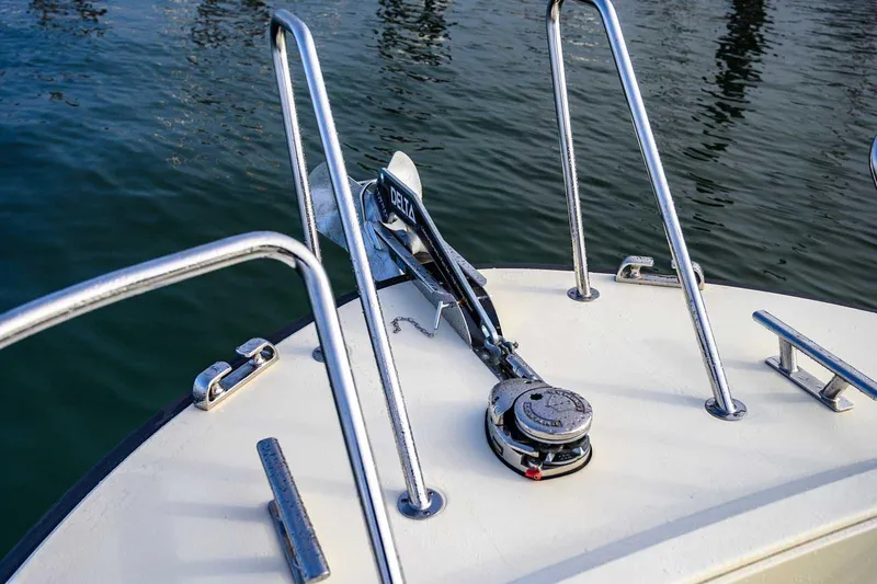  Yacht Photos Pics Bow of 2020 Targa 32 boat with anchor and railing on calm water.