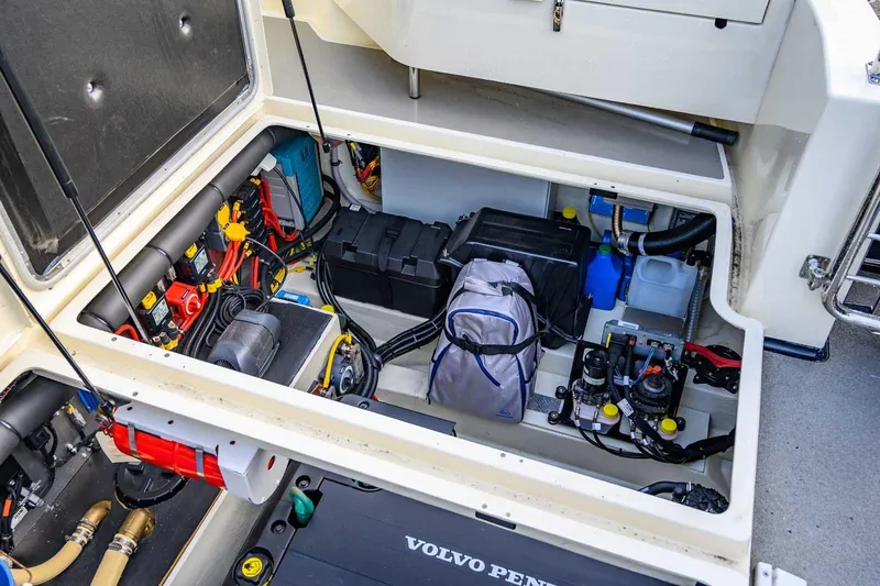  Yacht Photos Pics Engine compartment of 2020 Targa 32 boat with Volvo Penta components and organized storage.