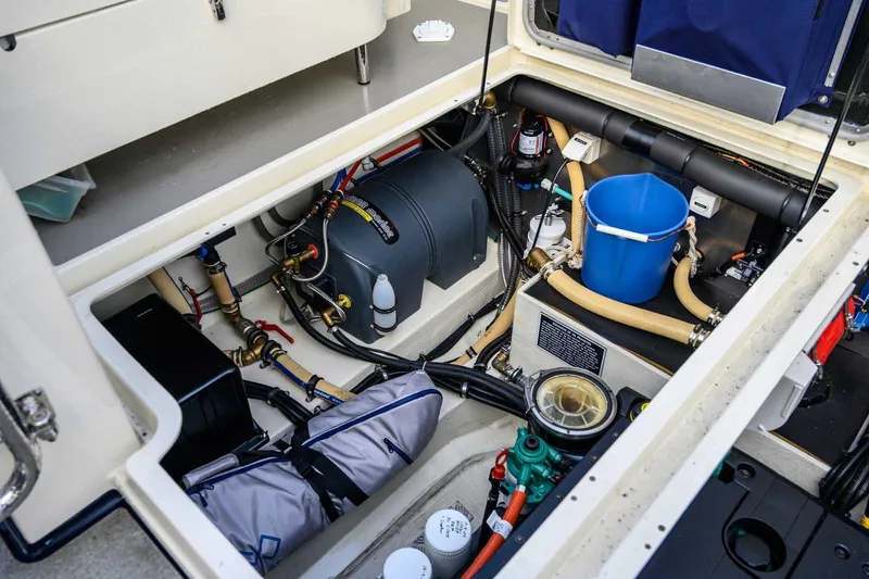  Yacht Photos Pics Engine compartment of 2020 Targa 32 boat, showcasing mechanical components and storage.