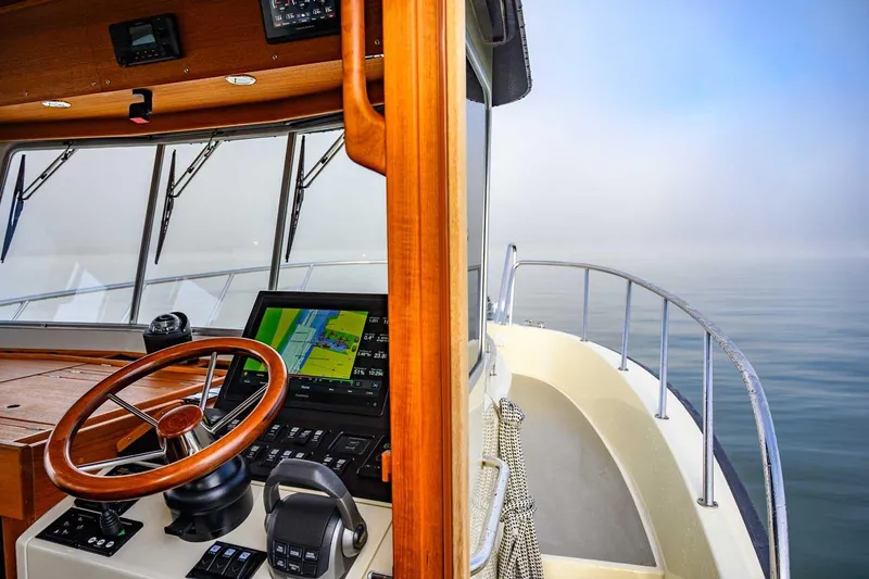  Yacht Photos Pics Pilot cabin of 2020 Targa 32 boat with steering wheel and navigation system.