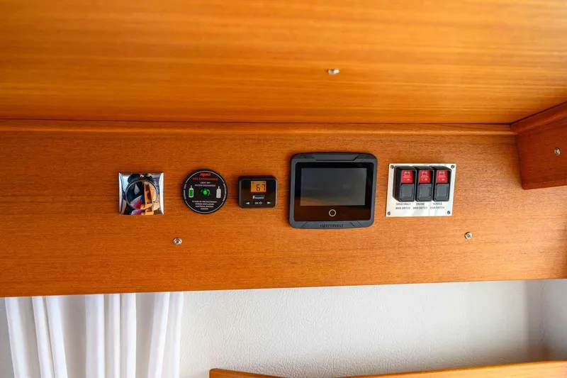  Yacht Photos Pics Control panel of a 2020 Targa 32 boat with various switches and displays.