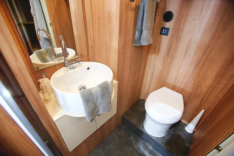  Yacht Photos Pics Modern bathroom in 2017 Cranchi Eco Trawler 53 Long Distance yacht with sink and toilet.