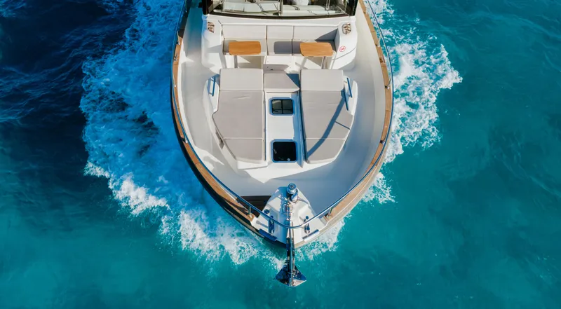 Yacht Photos Pics Aerial view of 2017 Cranchi Eco Trawler 53 Long Distance cruising in clear blue waters.