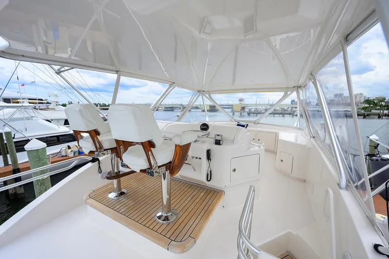 Goin Deep Yacht Photos Pics Flybridge of 2014 Bertram 700 yacht with helm chairs and panoramic view.
