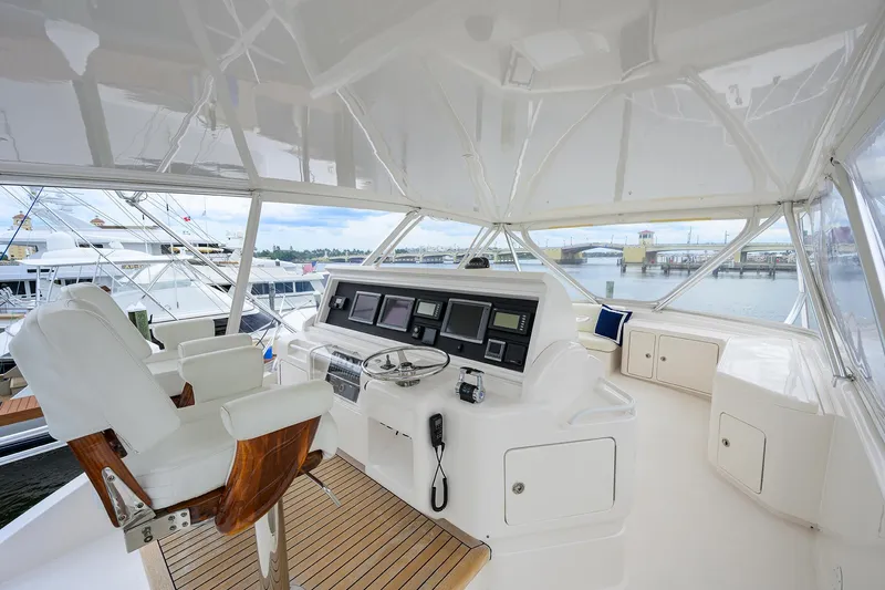 Goin Deep Yacht Photos Pics Helm of 2014 Bertram 700 yacht with modern navigation equipment and luxurious seating.