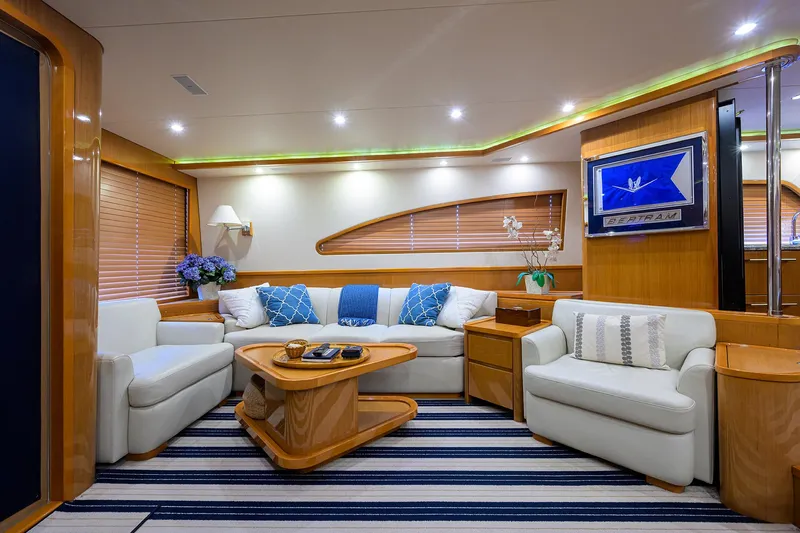 Goin Deep Yacht Photos Pics Luxurious interior of a 2014 Bertram 700 yacht with elegant seating and decor.