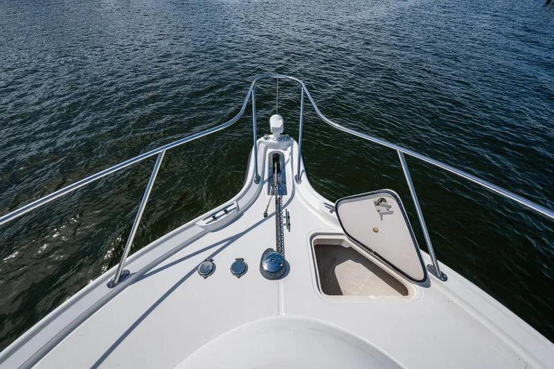  Yacht Photos Pics Bow view of 2008 Tiara Yachts 3200 Open on water, featuring anchor hatch.