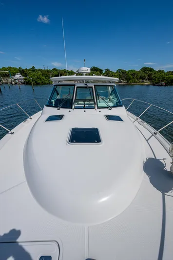  Yacht Photos Pics 2008 Tiara Yachts 3200 Open on water, showcasing sleek deck and cabin design.