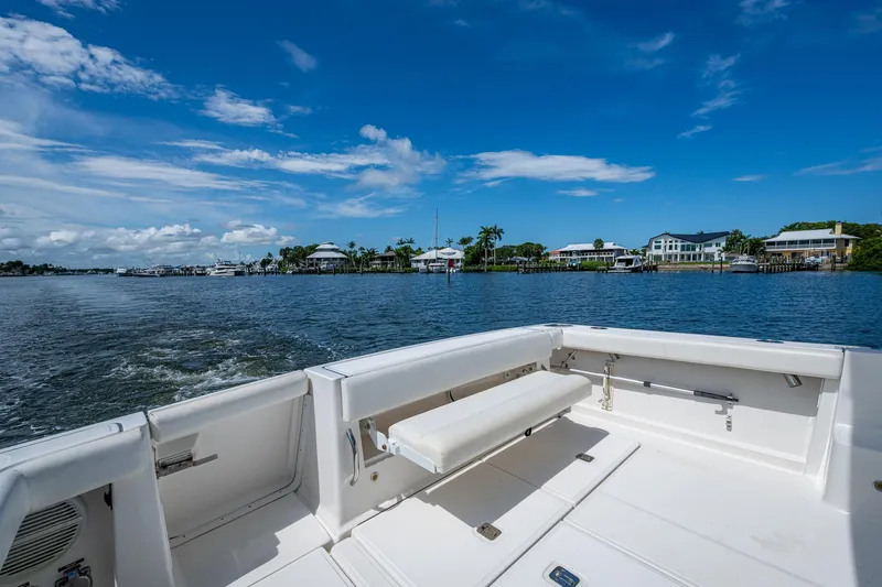  Yacht Photos Pics 2008 Tiara Yachts 3200 Open on calm waters with scenic coastal view.