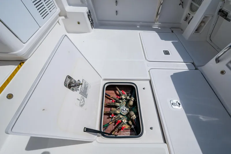  Yacht Photos Pics Open hatch on 2008 Tiara Yachts 3200 Open, revealing mechanical components.