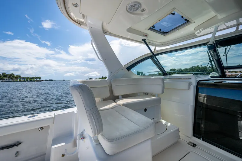  Yacht Photos Pics 2008 Tiara Yachts 3200 Open interior with white seating, overlooking serene waters.