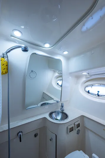  Yacht Photos Pics 2008 Tiara Yachts 3200 Open bathroom with sink, mirror, and showerhead.
