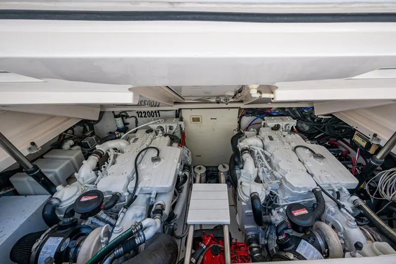  Yacht Photos Pics Engine compartment of a 2008 Tiara Yachts 3200 Open, showcasing dual engines and mechanical components.