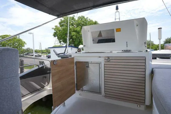 Kedem Plus Yacht Photos Pics 2021 Beneteau Monte Carlo 52 yacht deck with outdoor kitchen amenities.