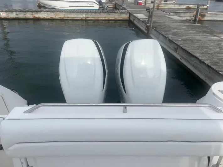  Yacht Photos Pics Twin outboard engines on a 2002 Boston Whaler 295 Conquest WA at dock.