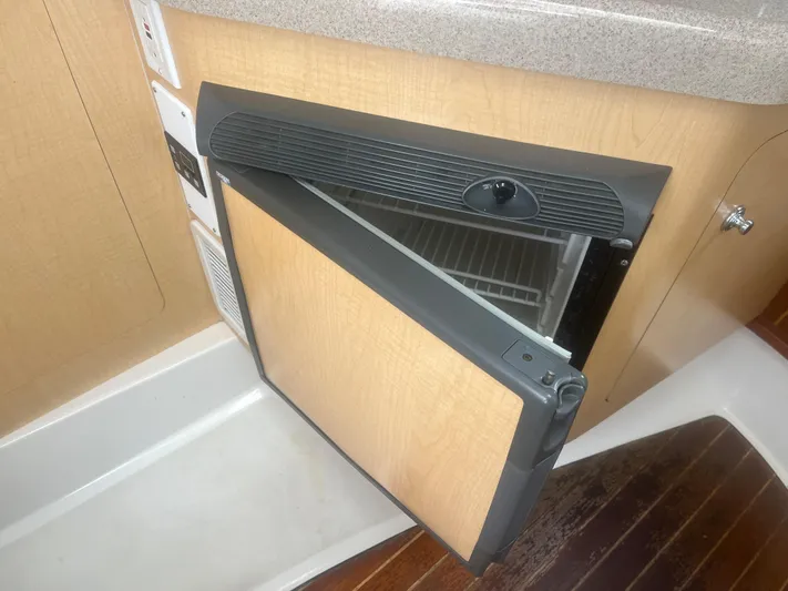  Yacht Photos Pics Open refrigerator in 2002 Boston Whaler 295 Conquest WA boat interior.