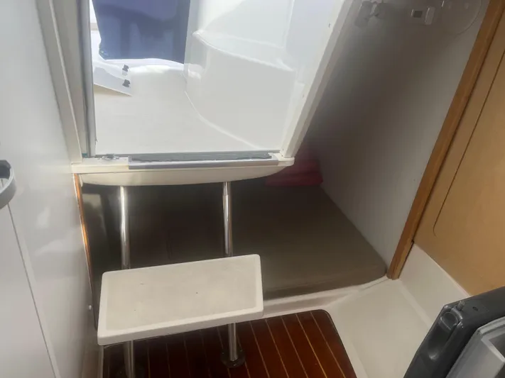  Yacht Photos Pics Interior cabin of 2002 Boston Whaler 295 Conquest WA with steps and seating area.