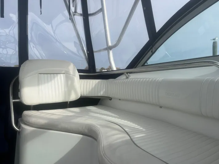  Yacht Photos Pics Interior of 2002 Boston Whaler 295 Conquest WA with white seating and sleek design.