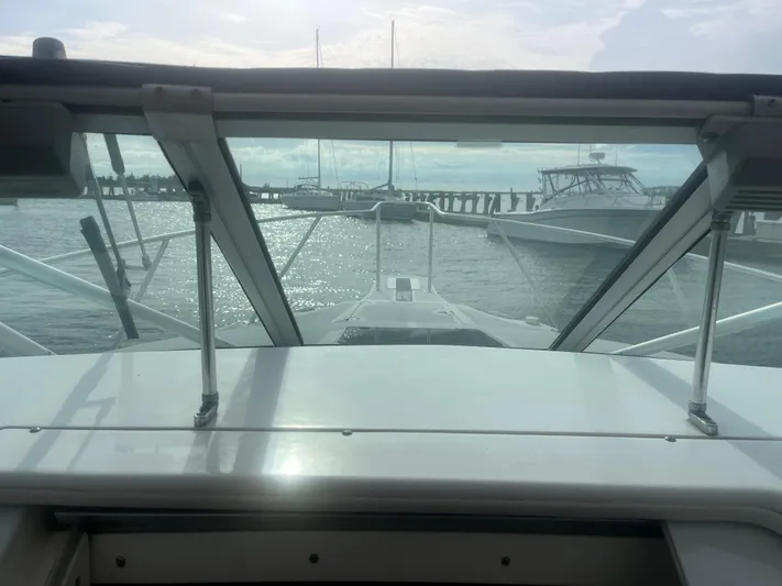  Yacht Photos Pics Boston Whaler 295 Conquest WA 2002, docked with marina view through windshield.