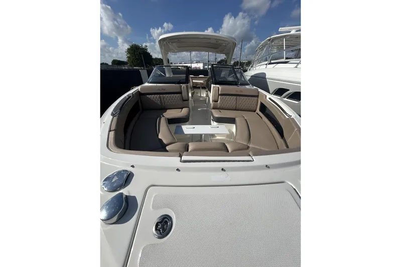  Yacht Photos Pics 2017 Sea Ray SLX 310 Outboard boat with spacious seating and sleek design under a clear sky.