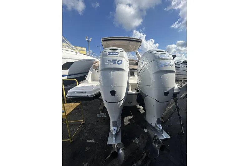  Yacht Photos Pics 2017 Sea Ray SLX 310 Outboard with twin 350 Verado engines under a blue sky.