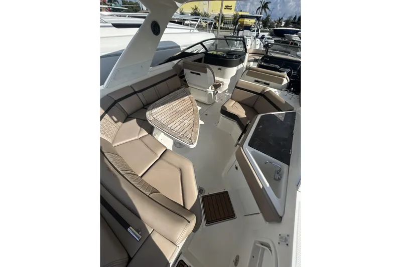  Yacht Photos Pics 2017 Sea Ray SLX 310 Outboard interior with luxurious seating and sleek design.