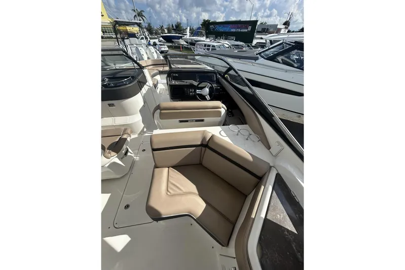 Yacht Photos Pics 2017 Sea Ray SLX 310 Outboard interior with tan seating and modern dashboard.
