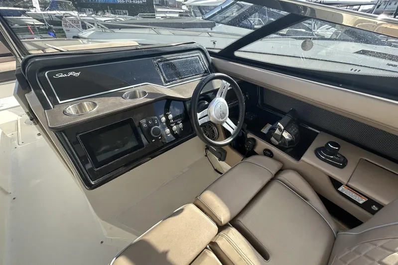  Yacht Photos Pics 2017 Sea Ray SLX 310 Outboard helm with steering wheel and control panel.