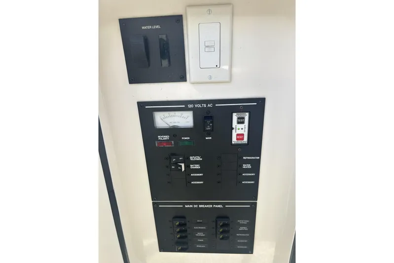  Yacht Photos Pics Electrical panel of 2017 Sea Ray SLX 310 Outboard boat, showing controls and switches.