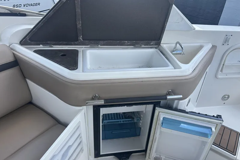  Yacht Photos Pics 2017 Sea Ray SLX 310 Outboard interior with sink and mini fridge.