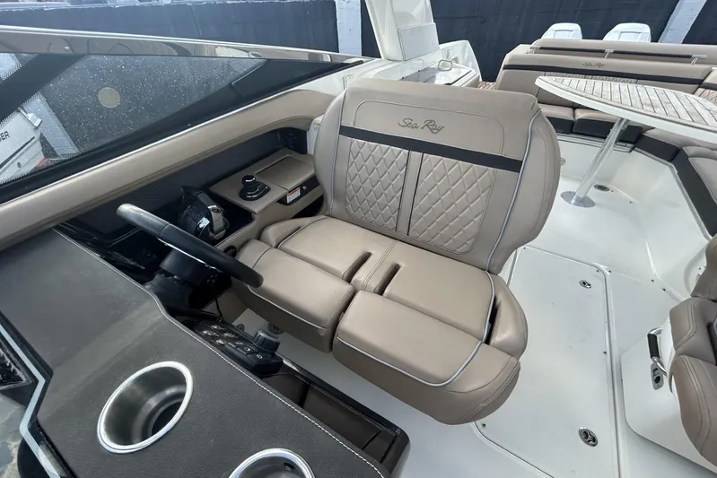  Yacht Photos Pics 2017 Sea Ray SLX 310 Outboard cockpit with luxurious seating and modern controls.