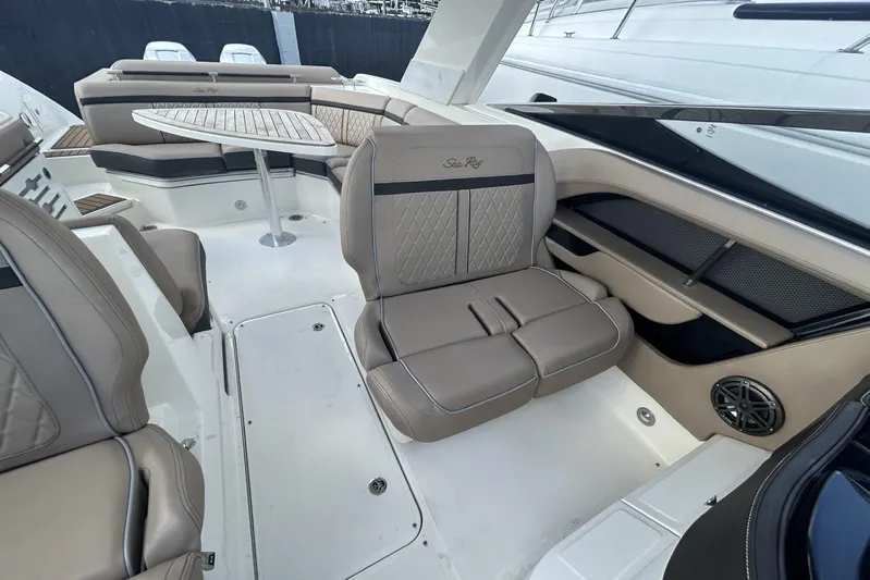  Yacht Photos Pics Luxurious interior of 2017 Sea Ray SLX 310 Outboard with elegant seating and table.