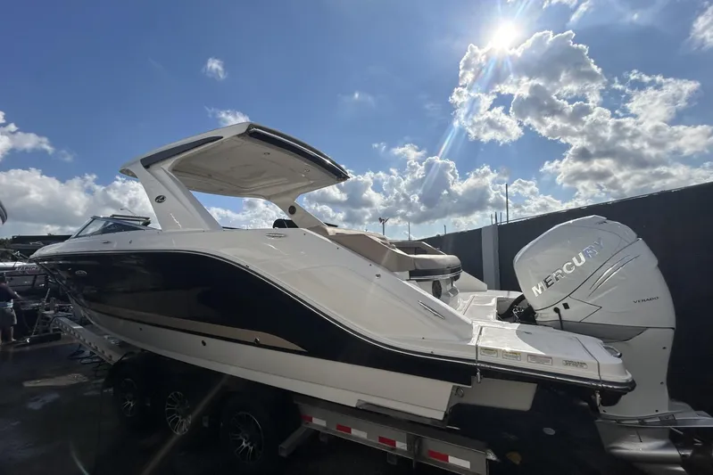  Yacht Photos Pics 2017 Sea Ray SLX 310 Outboard boat with Mercury engines under a sunny sky.