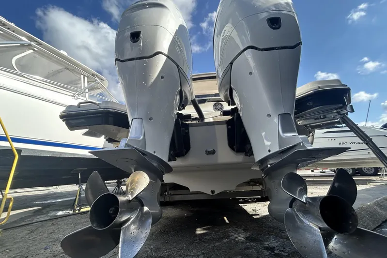  Yacht Photos Pics 2017 Sea Ray SLX 310 Outboard with dual engines, docked under a clear sky.