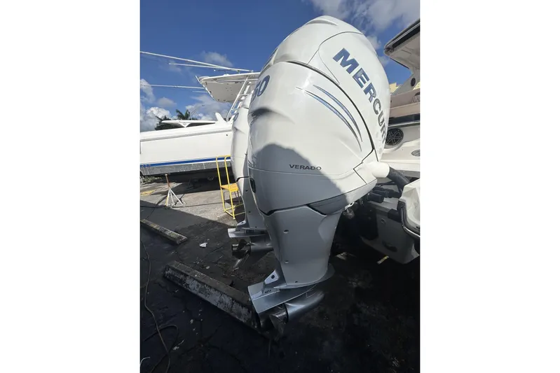  Yacht Photos Pics 2017 Sea Ray SLX 310 Outboard with Mercury Verado engine, docked under blue sky.
