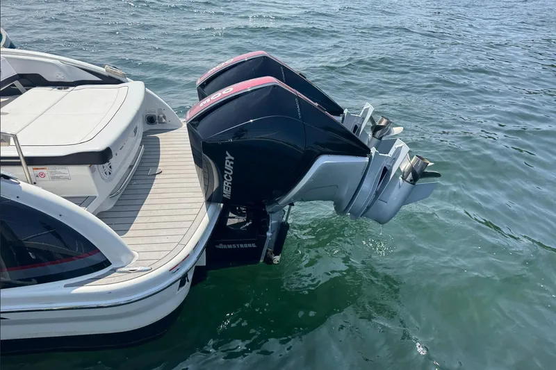  Yacht Photos Pics 2022 Formula 310 Bowrider OB with dual Mercury outboard engines on water.