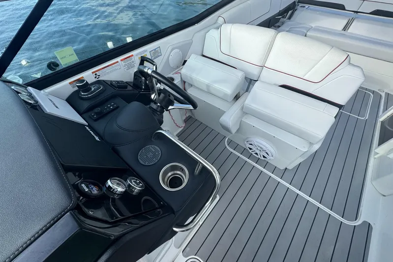  Yacht Photos Pics 2022 Formula 310 Bowrider OB cockpit with modern steering and white seating.