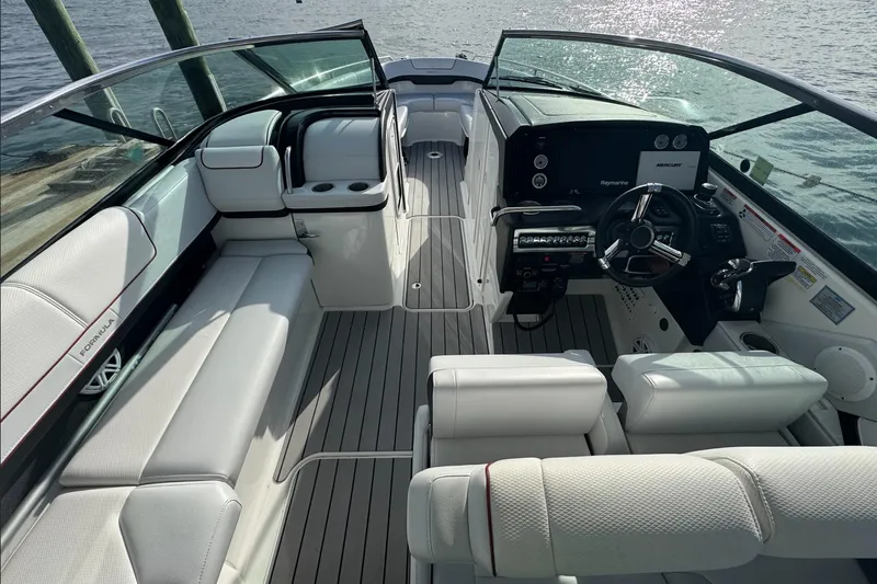  Yacht Photos Pics 2022 Formula 310 Bowrider OB interior with luxurious seating and modern dashboard.