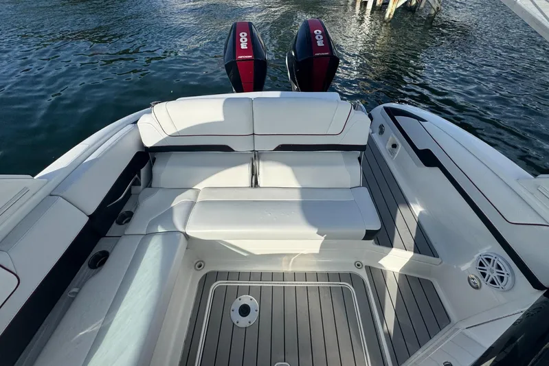  Yacht Photos Pics 2022 Formula 310 Bowrider OB boat interior with seating and twin outboard engines.