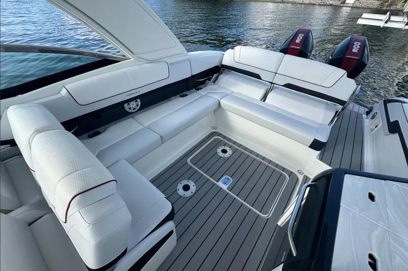 Yacht Photos Pics 2022 Formula 310 Bowrider OB interior with luxurious seating and dual outboard engines.