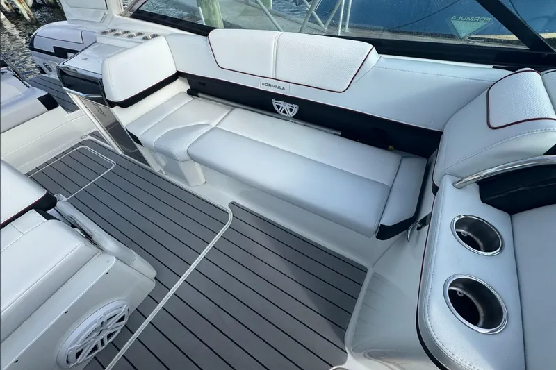  Yacht Photos Pics 2022 Formula 310 Bowrider OB interior with white seating and gray flooring.